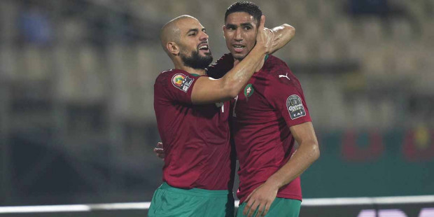 Achraf Hakimi (right) has scored two incredible goals for Morocco at the AFCON 2021